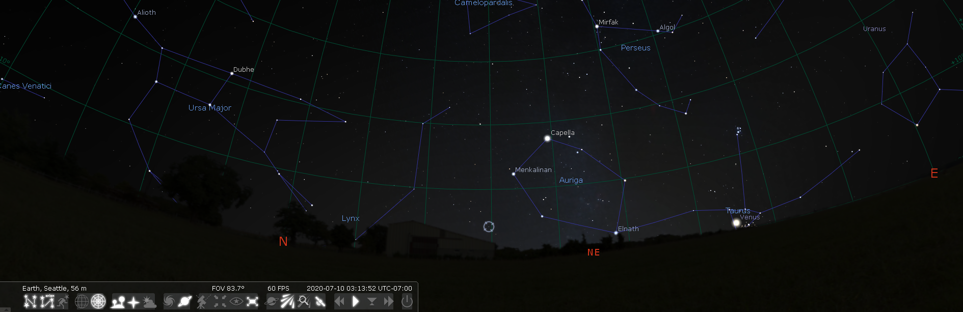 a Seattle horizon view from Stellarium here for July 10th at 3am. It will show a small marker next to the Northeast horizon between the constellations of Auriga to the right/North and Ursa Major (the Big Dipper) to the left/South. The marker is about 1/4 of the from Auriga to Ursa Major, it is much closer to Auriga.