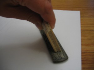 Hold the wood at the correct angle and drag across the file